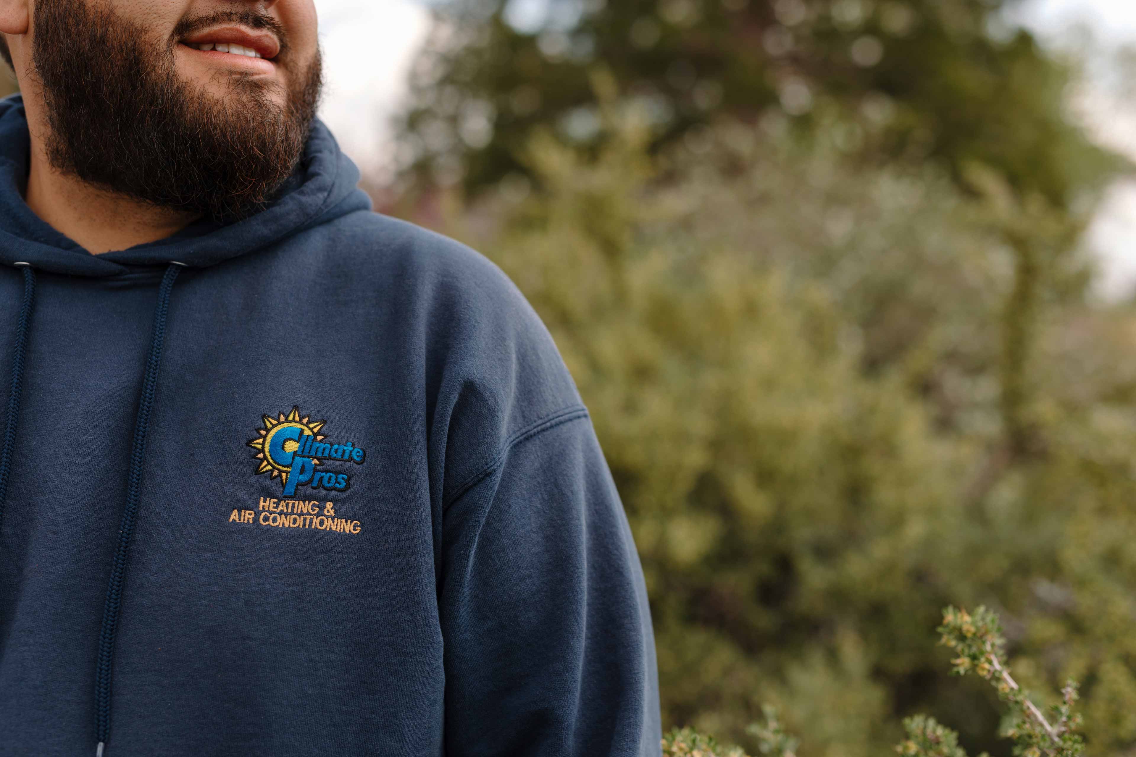 climate pros employee wearing a jacket with the climate pros logo