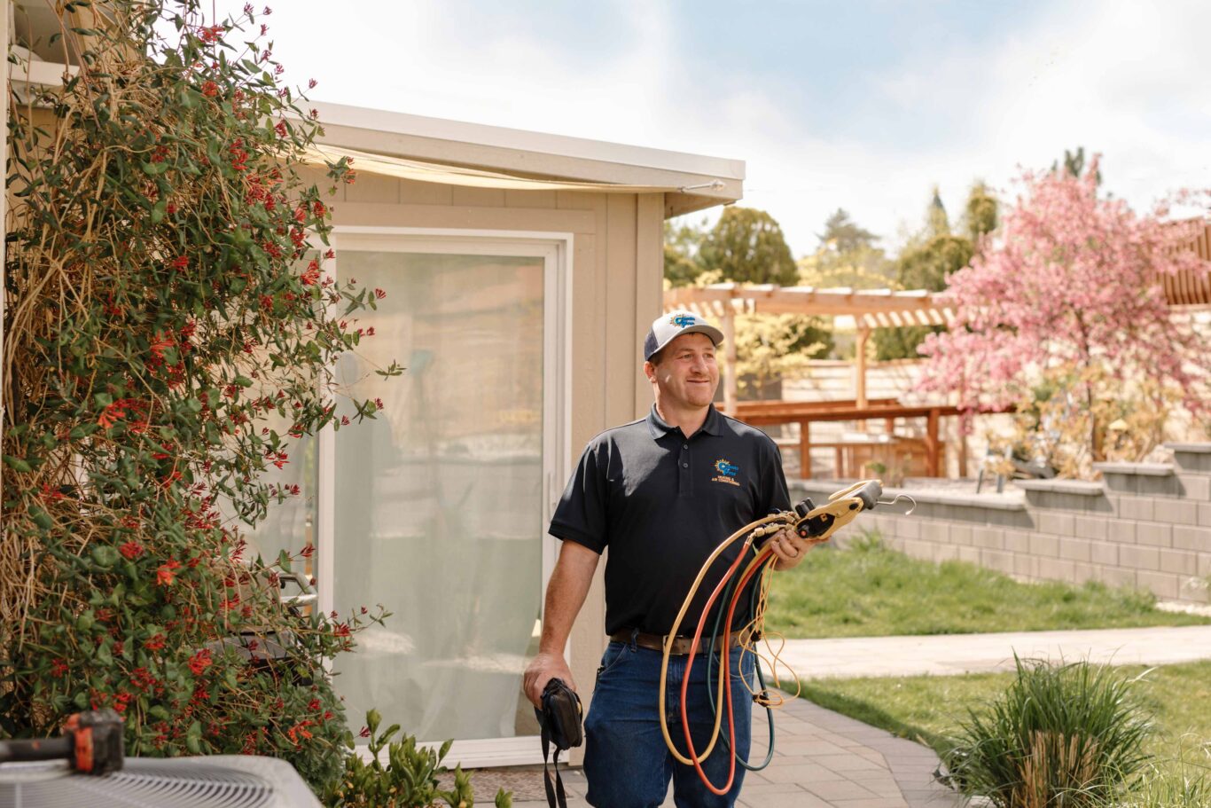 climate pros technician with tools to perform a diagnosis