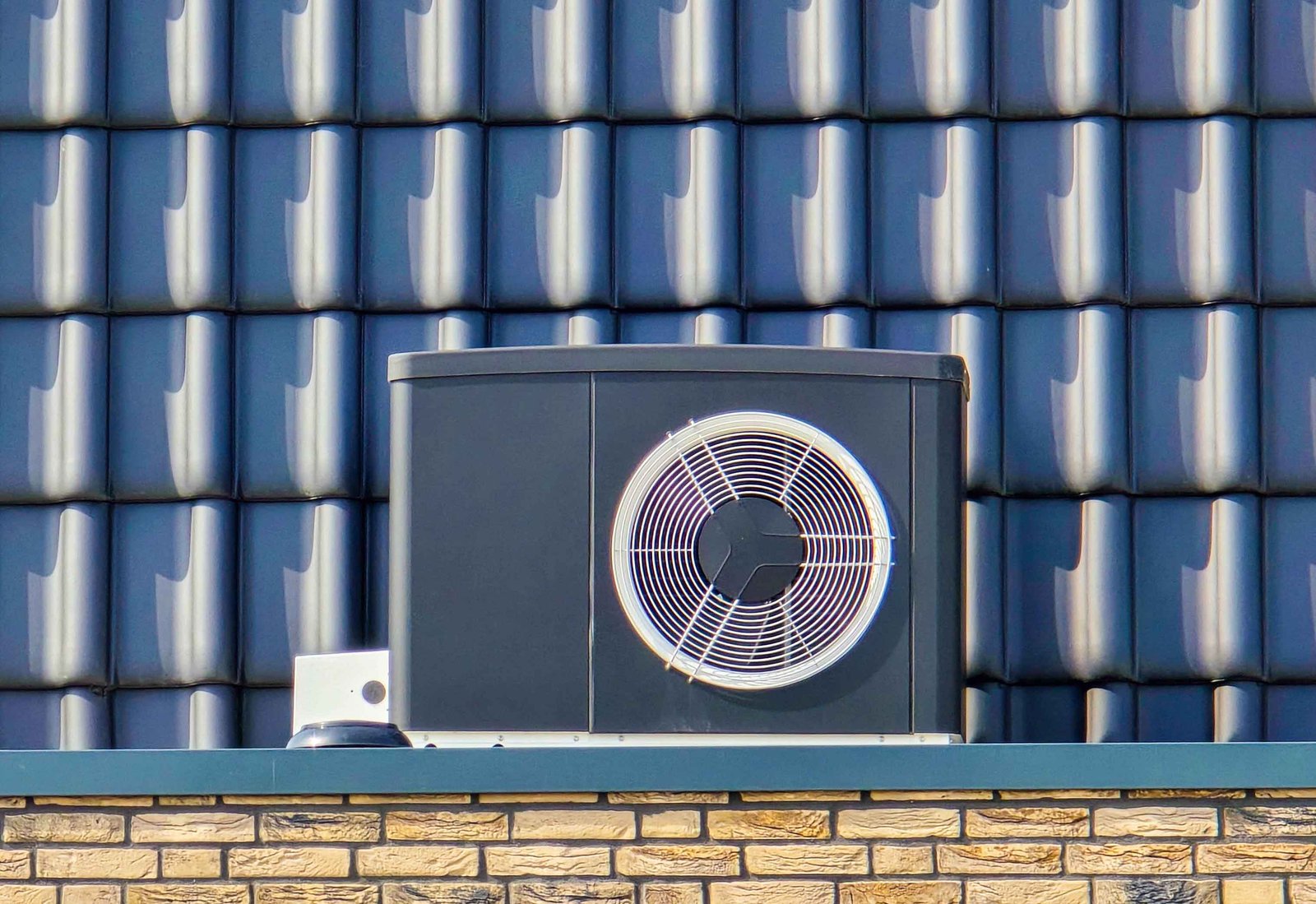 air source heat pump unit installed outdoors at a retail store