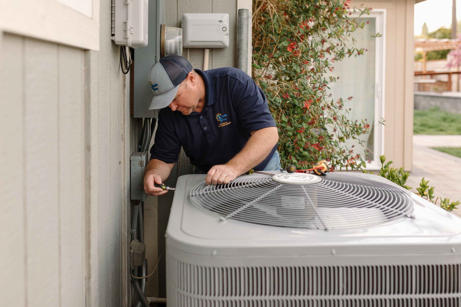 hvac technician checking a swamp cooler unit