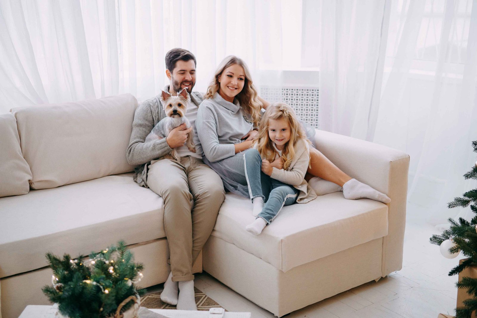 happy family mom dad daughter and pet family breathing clean air