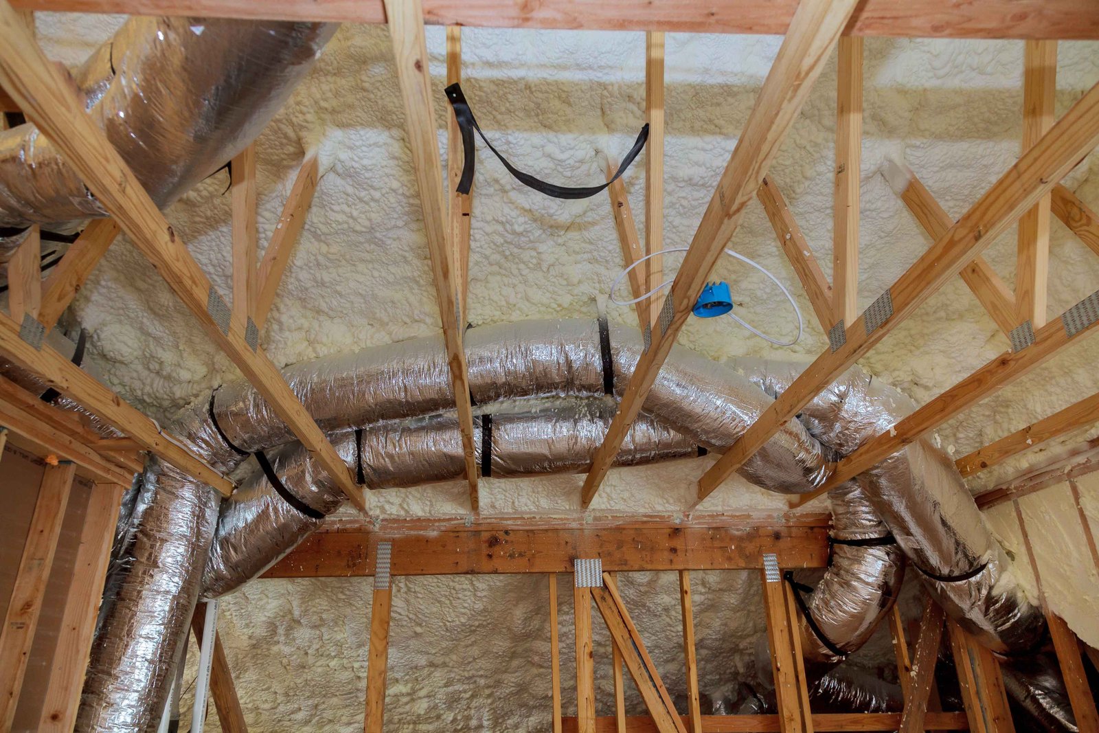 insulation of attic with fiberglass cold barrier and ducts