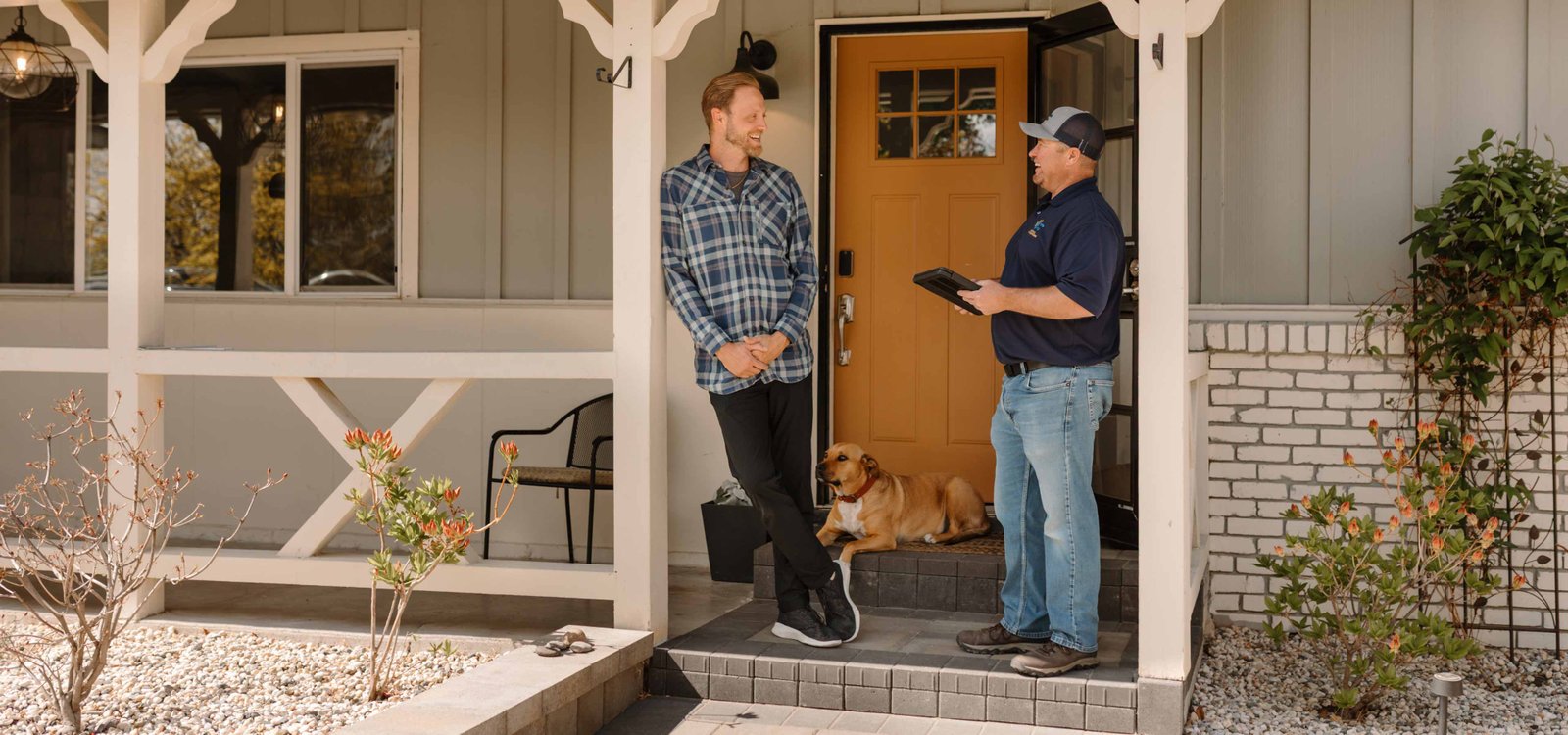climate pros tech talking with home owner