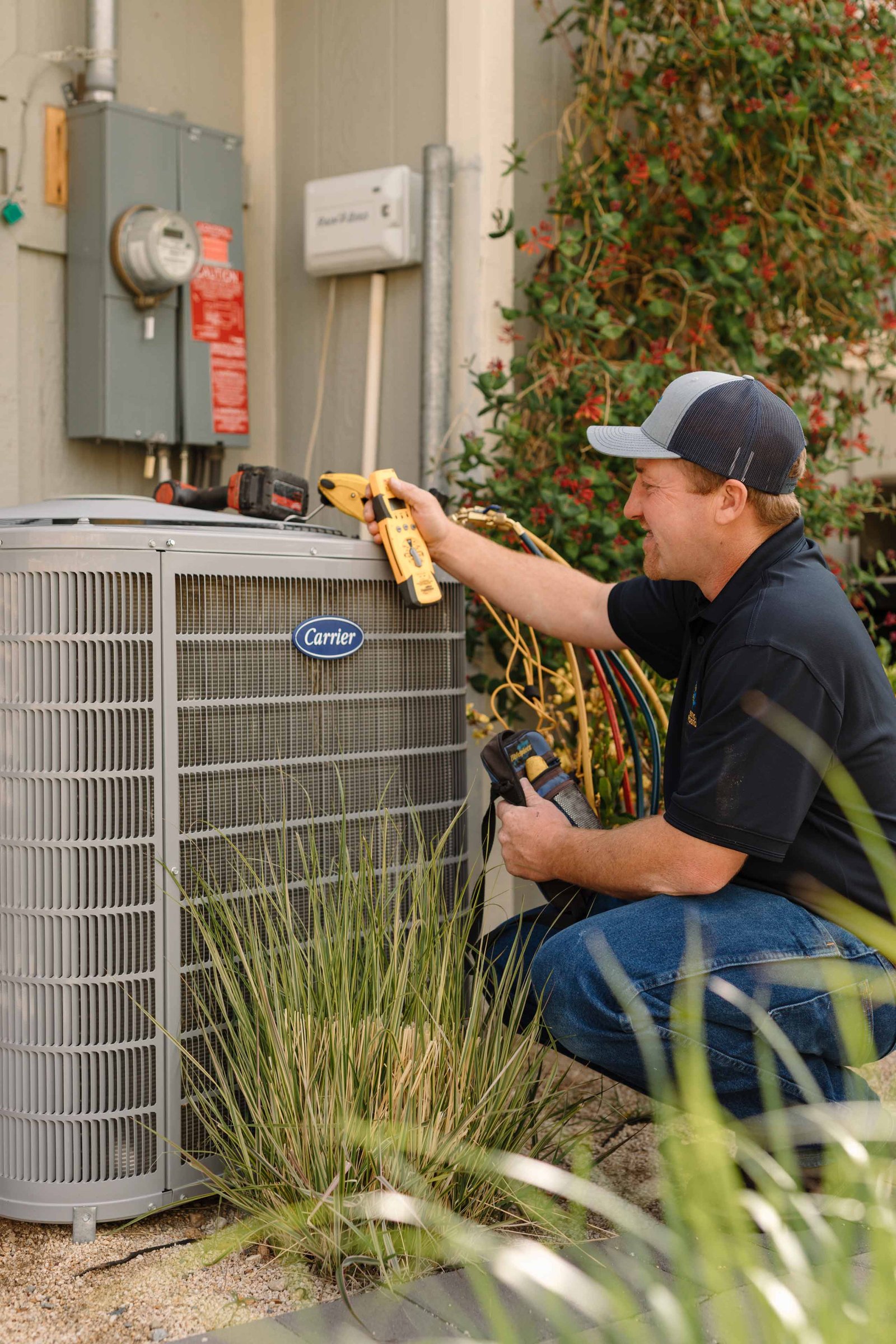 hvac tech servicing a swamp cooler under warranty